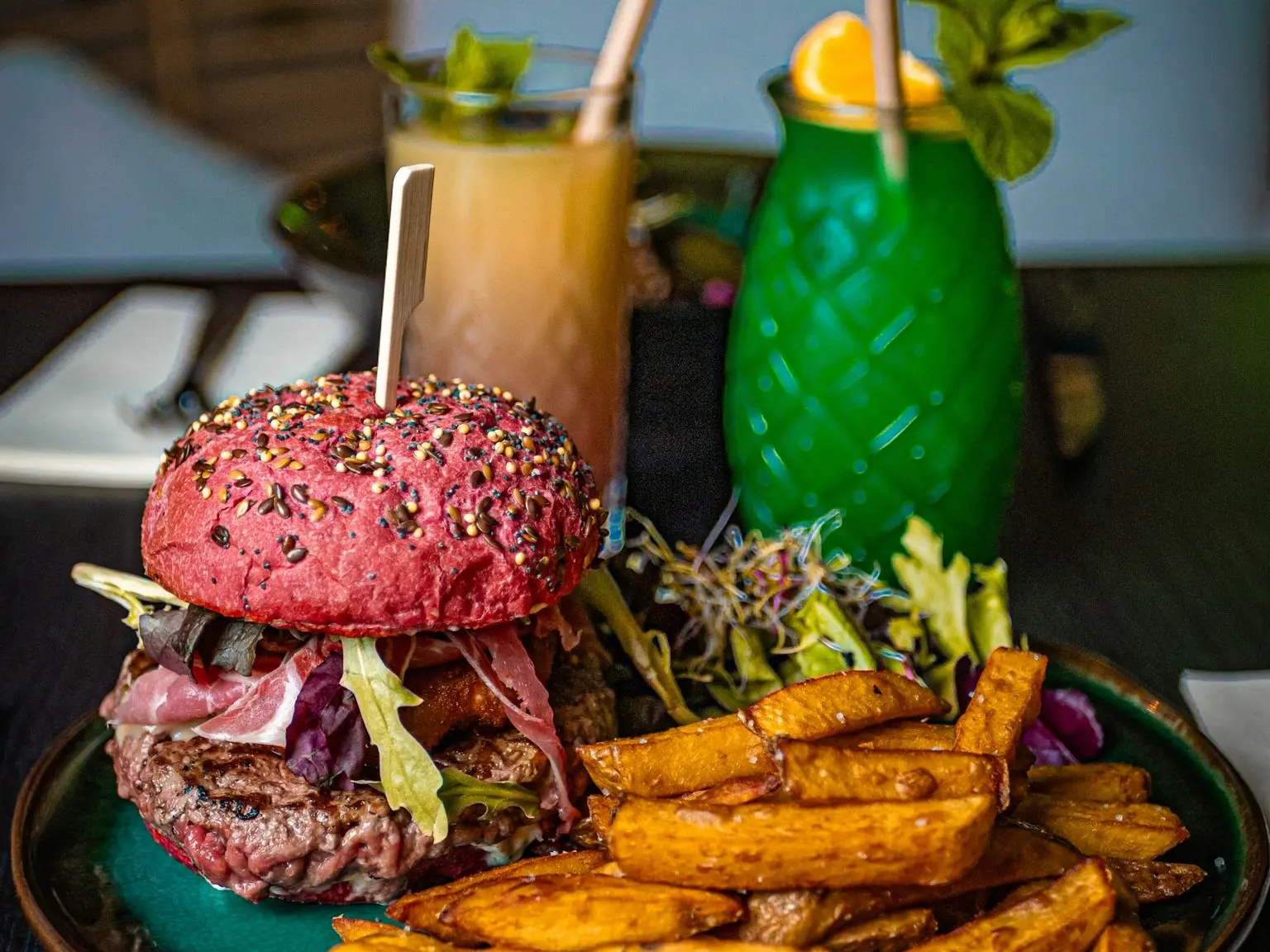 a plate with a hamburger and french fries on it